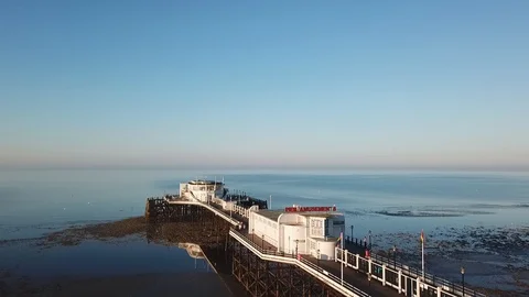 Pier at low tide drone falling shot Video stock 95411877