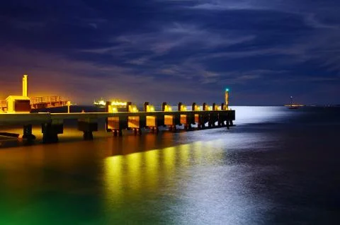 Pier at night Stock Photos