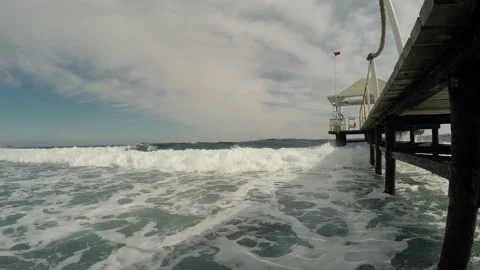 Pier on the ocean shore in the storm  Stock Footage 154273989