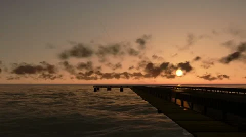 Pier in Ocean at sunset, time lapse clouds, camera panning Video stock 22414332