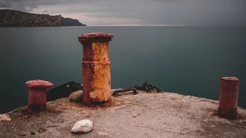 Pier with rusty pillars Stock Photos