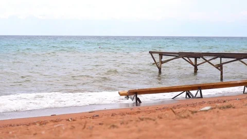 Pier on the sandy beach by the sea Stock Footage 94932655