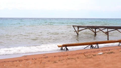 Pier on the sandy beach by the sea Stock Footage 95834772