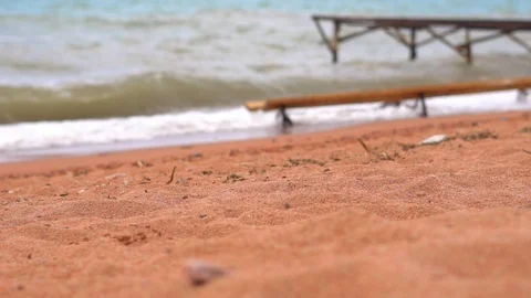 Pier on the sandy beach by the sea Stock Footage 99436557