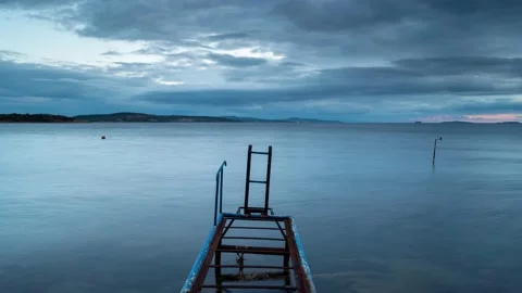 Pier Sea timelapse with Clouds on blue hours Stock Footage 131645576