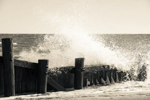 Pier Sea Wall at Ocean showing tranquility and power Stock Photos