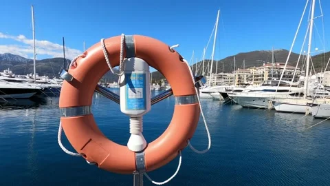Pier security post against the background of yachts moored off the coast Stock Footage 233380141