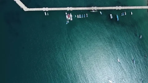 A pier with some boats from above. Reflection Stock Footage 157387370