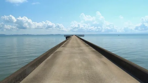 Pier stretching to the horizon on the lake Thailand Stock Footage 72504053