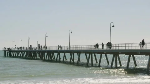 Pier in summer next to calm ocean 4k Stock Footage 282632424