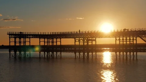 Pier in the sunset. The clouds Stock Footage 86784347