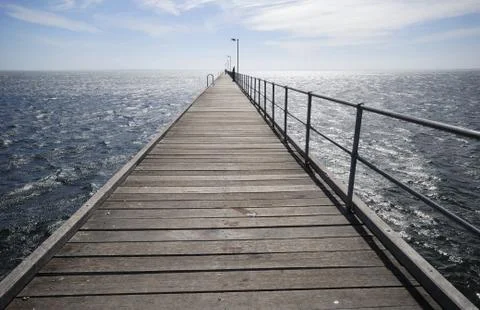 Pier at sunset Stock Photos