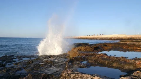 At the pier in Torrevieja. The spray splashes up at the camera pan. Stock Footage 138208756