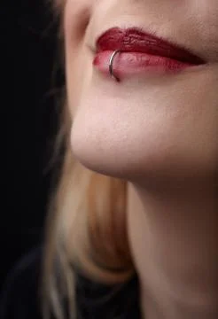Pierced red lips Stock Photos