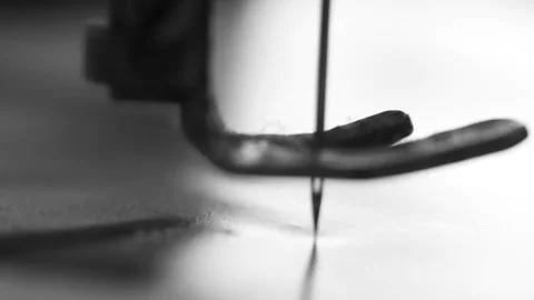 Piercing a magazine page with an old-fashioned sewing machine Stock Footage 237724408