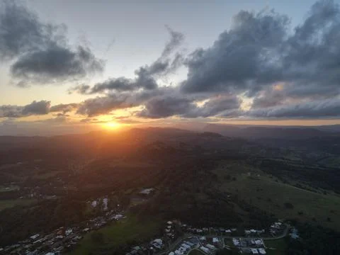 Piercing Sun Through Dark Clouds Stock Photos
