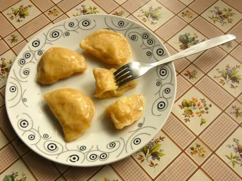 Pierogi On Plate With Fork Stock Photos