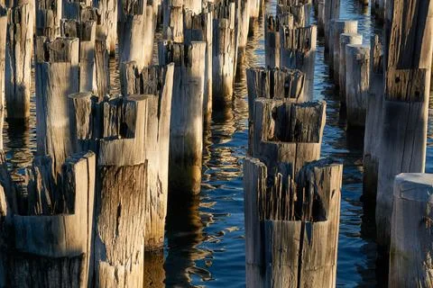 Piers at Sunset with Water Reflection Stock-Fotos