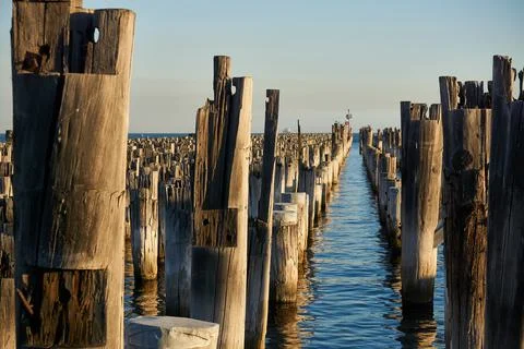 Piers at Sunset with Water Reflection Stock-Fotos
