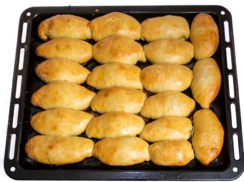 Pies on a baking sheet Stock Photos