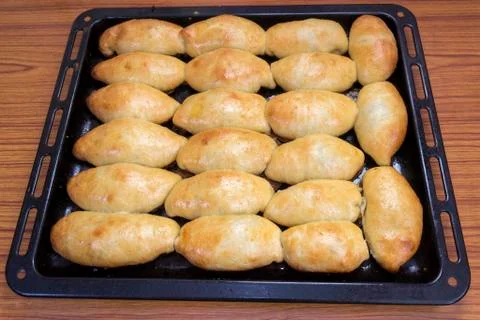 Pies on a baking sheet Stock Photos