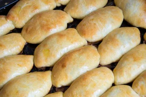 Pies on a baking sheet Stock Photos