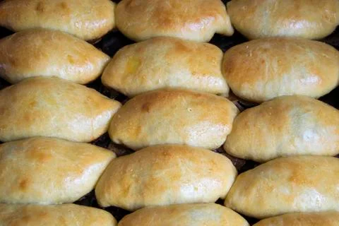 Pies on a baking sheet Stock Photos