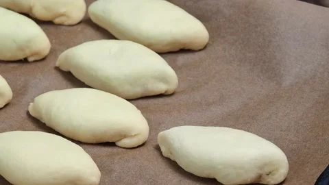 Pies on a baking tray. Stock Footage 229688504