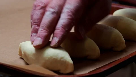 Pies on a baking tray. Stock Footage 229688525