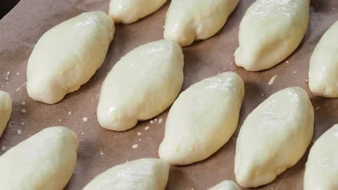Pies on a baking tray. Stock Footage 229688535