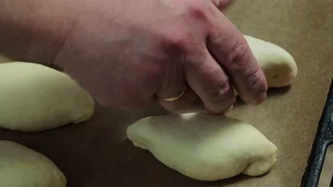 Pies on a baking tray. Stock Footage 229688544