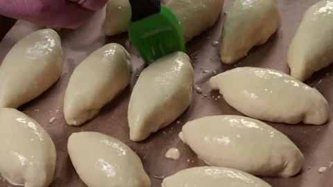 Pies on a baking tray. Stock Footage 229757531
