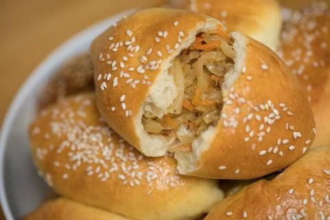 Pies with cabbage, closeup Stock Photos