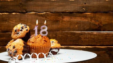 Pies with a number 18  of candles burning for the anniversary. Copy space b.. Stock Photos