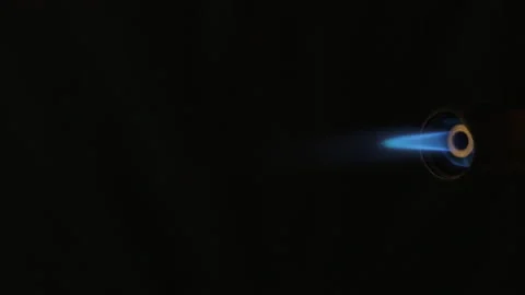 Piezo ignition of a gas burner. A stream of blue orange flame Stock Footage 86902484