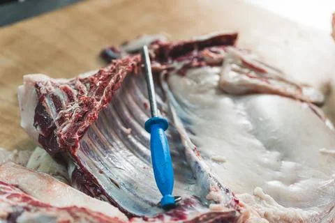 Pig meat processing and preparing at the butchers shop Stock Photos