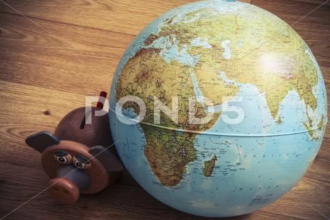 Pig money box with globe Stock Photos