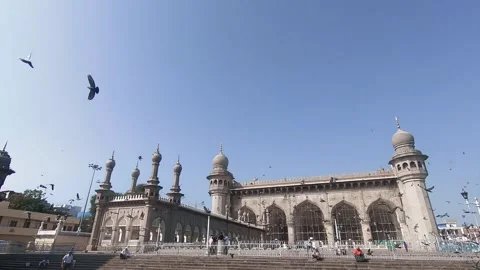 Pigeon birds flying in sky at Mecca masjid,Hyderabad city Stock Footage