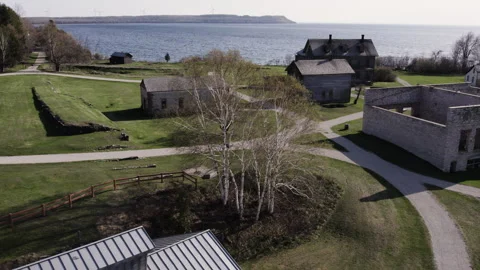 Pigeons flocking by a ghost town, 4k, slow-mo drone shot Stock Footage 243535083