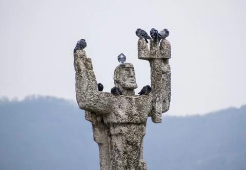 Pigeons on a statue. Stock Photos