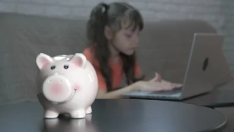 Piggy bank by computer. Stock Footage 206174094