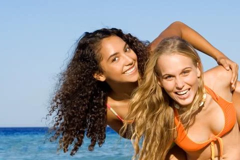 Piggyback fun on spring break or summer vacation Stock Photos