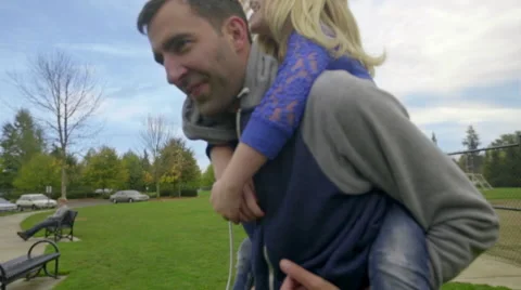 Piggyback ride from dad Stock Footage 56693508