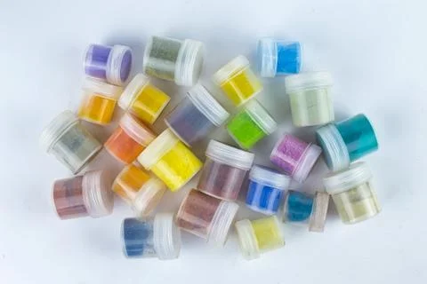 Pigments in cans on a white background Stock Photos