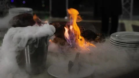Pig's leg flomber. Close up of Burning pork meat in the restaurant. Dry ice is Stock Footage 248430289