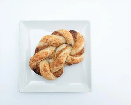 Pigtail bun on a white background Stock Photos