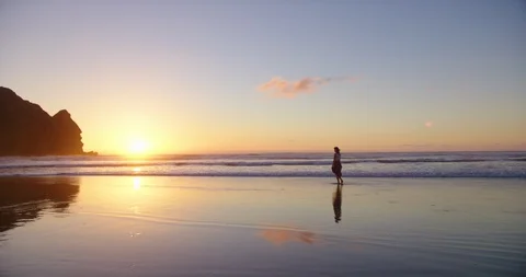 Piha beach walk at sunset Stock Footage 125390797