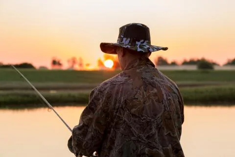 Pike hunter on the river Fotos Stock