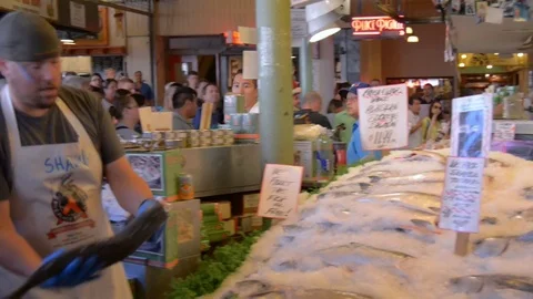 Pike place fish market throwing fish twice Stock Footage 83397584