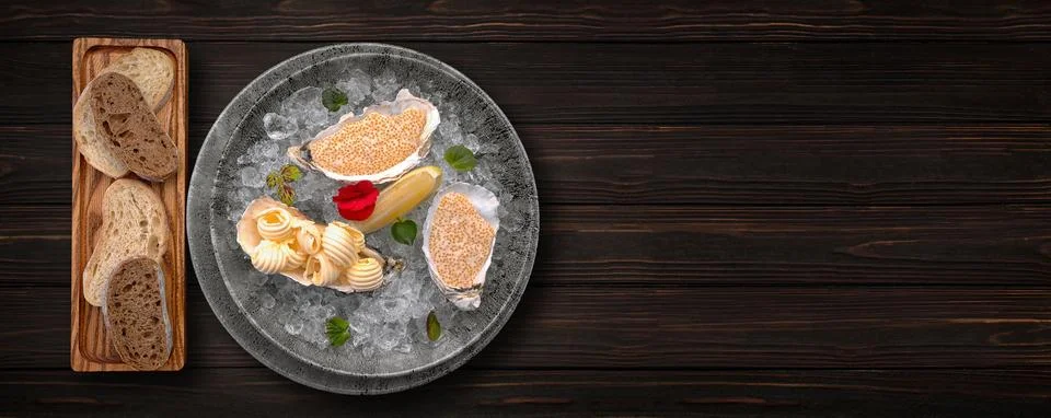 Pike roe on ice, with bread toasts and butter Stock Photos